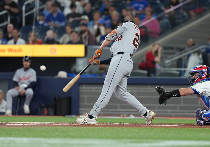 May 18, 2025; Toronto, Ontario, CAN; Detroit Tigers first baseman Spencer Torkelson (20) hits an RBI double against the Toronto Blue Jays during the first inning at Rogers Centre. Mandatory Credit: Nick Turchiaro-Imagn Images