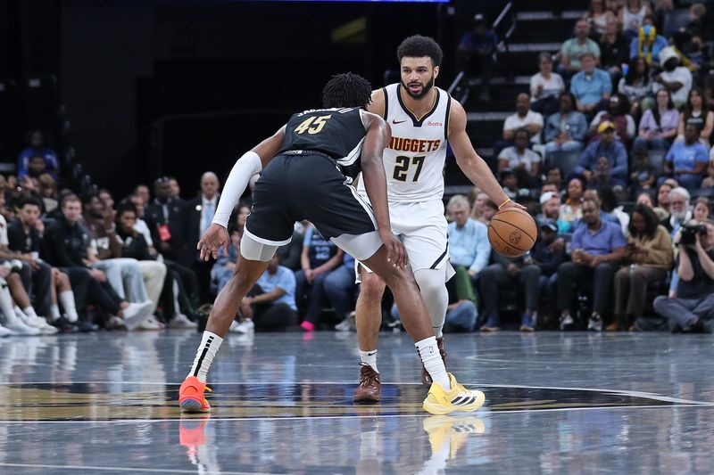 MEMPHIS, TENNESSEE - APRIL 14: Jamal Murray #27 of the Denver Nuggets handles the ball during the first half against GG Jackson #45 of the Memphis Grizzlies at FedExForum on April 14, 2024 in Memphis, Tennessee. NOTE TO USER: User expressly acknowledges and agrees that, by downloading and or using this photograph, User is consenting to the terms and conditions of the Getty Images License Agreement. (Photo by Justin Ford/Getty Images)