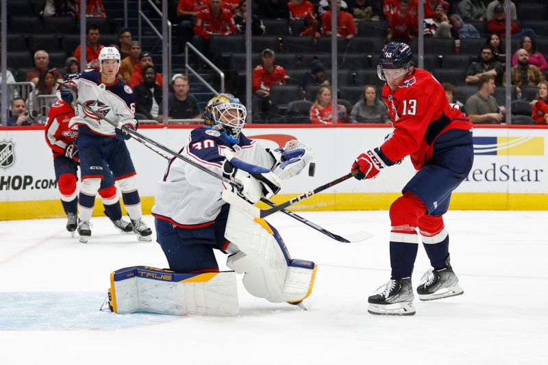 Sep 27, 2024; Washington, District of Columbia, USA; Columbus Blue Jackets goaltender Pavel Cajan (30) makes a save on Washington Capitals forward Jakob Vrana (13) in the third period at Capital One Arena. Mandatory Credit: Geoff Burke-Imagn Images