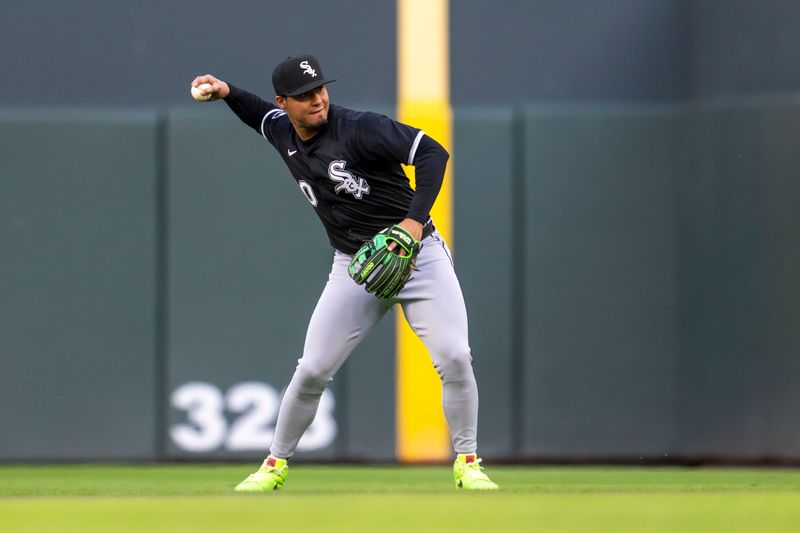 Apr 22, 2025; Minneapolis, Minnesota, USA; Chicago White Sox second baseman Lenyn Sosa (50) throws the ball to first base for an out against the Minnesota Twins in the first inning at Target Field. Mandatory Credit: Jesse Johnson-Imagn Images