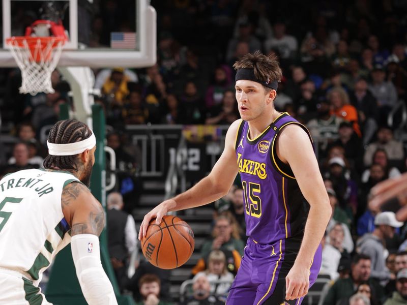 MILWAUKEE, WI - MARCH 13: Austin Reaves #15 of the Los Angeles Lakers handles the ball during the game against the Milwaukee Bucks on March 13, 2025 at Fiserv Forum Center in Milwaukee, Wisconsin. NOTE TO USER: User expressly acknowledges and agrees that, by downloading and or using this Photograph, user is consenting to the terms and conditions of the Getty Images License Agreement. Mandatory Copyright Notice: Copyright 2025 NBAE(Photo by Gary Dineen/NBAE via Getty Images).