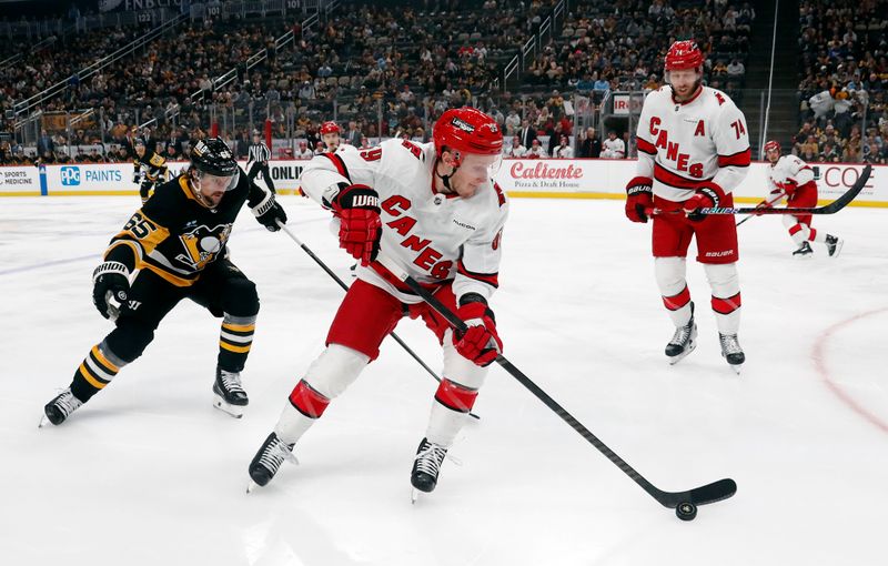 Mar 26, 2024; Pittsburgh, Pennsylvania, USA; Carolina Hurricanes defenseman Jaccob Slavin (74) against at PPG Paints Arena. Mandatory Credit: Charles LeClaire-USA TODAY Sports