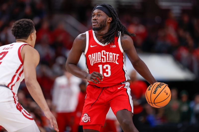 Mar 8, 2023; Chicago, IL, USA; Ohio State Buckeyes guard Isaac Likekele (13) brings the ball up court against the Wisconsin Badgers during the first half at United Center. Mandatory Credit: Kamil Krzaczynski-USA TODAY Sports