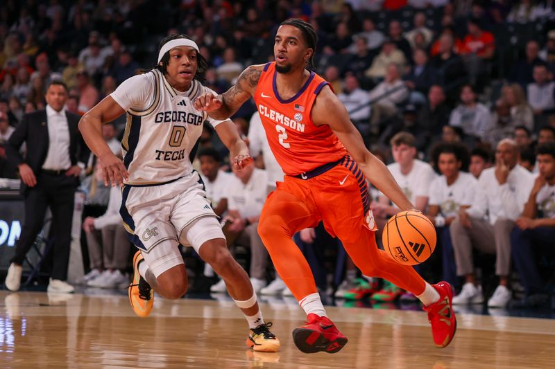 Jan 24, 2026; Atlanta, Georgia, USA; Clemson Tigers guard Dillon Hunter (2) drives past Georgia Tech Yellow Jackets guard Akai Fleming (0) in the first half at McCamish Pavilion. Mandatory Credit: Brett Davis-Imagn Images