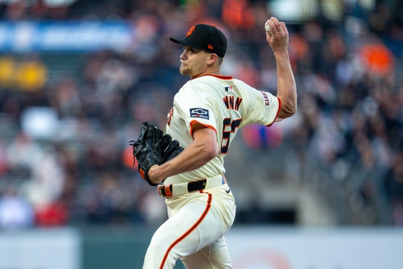 Apr 22, 2024; San Francisco, California, USA;  San Francisco Giants pitcher Keaton Winn (67) delivers a pitch against the New York Mets during the first inning at Oracle Park. Mandatory Credit: Neville E. Guard-USA TODAY Sports