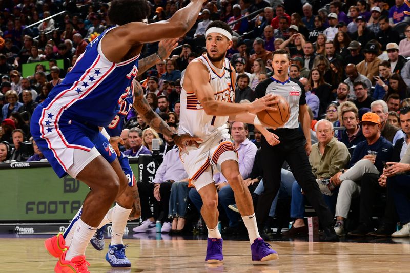 PHOENIX, AZ - NOVEMBER 4: Devin Booker #1 of the Phoenix Suns drives to the basket during the game against the Philadelphia 76ers on November 4, 2024 at Footprint Center in Phoenix, Arizona. NOTE TO USER: User expressly acknowledges and agrees that, by downloading and or using this photograph, user is consenting to the terms and conditions of the Getty Images License Agreement. Mandatory Copyright Notice: Copyright 2024 NBAE (Photo by Kate Frese/NBAE via Getty Images)