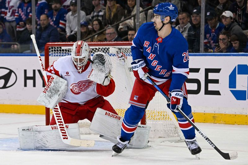 Oct 14, 2024; New York, New York, USA;  Detroit Red Wings goaltender Alex Lyon (34) makes a save as New York Rangers left wing Chris Kreider (20) attempts a screen during the first period at Madison Square Garden. Mandatory Credit: Dennis Schneidler-Imagn Images