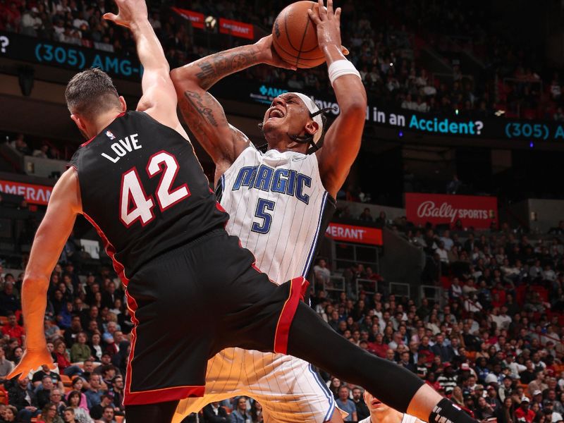 MIAMI, FL - FEBRUARY 6:  Paolo Banchero #5 of the Orlando Magic shoots the ball during the game against the Miami Heat on February 6, 2024 at Kaseya Center in Miami, Florida. NOTE TO USER: User expressly acknowledges and agrees that, by downloading and or using this Photograph, user is consenting to the terms and conditions of the Getty Images License Agreement. Mandatory Copyright Notice: Copyright 2024 NBAE (Photo by Issac Baldizon/NBAE via Getty Images)