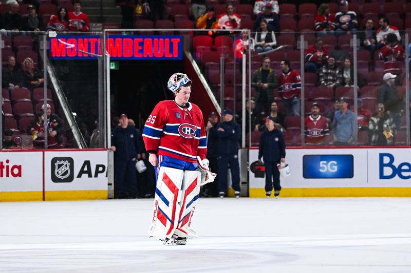 Feb 27, 2024; Montreal, Quebec, CAN; Montreal Canadiens goalie Sam Montembeault (35) first star of the game salutes the crowd after the end of the game against the Arizona Coyotes at Bell Centre. Mandatory Credit: David Kirouac-USA TODAY Sports