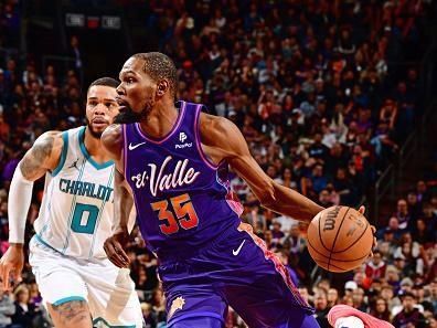 PHOENIX, AZ - DECEMBER 29: Kevin Durant #35 of the Phoenix Suns dribbles the ball during the game against the Charlotte Hornets on December 29 2023 at Footprint Center in Phoenix, Arizona. NOTE TO USER: User expressly acknowledges and agrees that, by downloading and or using this photograph, user is consenting to the terms and conditions of the Getty Images License Agreement. Mandatory Copyright Notice: Copyright 2023 NBAE (Photo by Barry Gossage/NBAE via Getty Images)