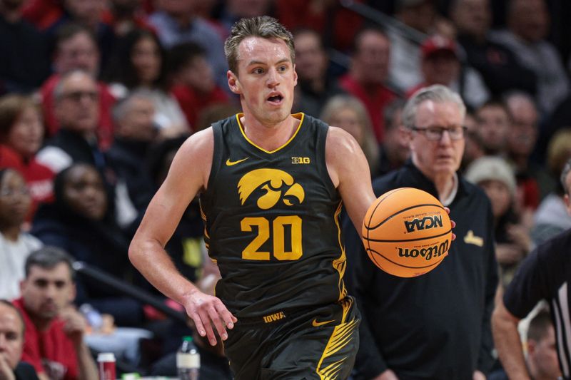 Feb 12, 2025; Piscataway, New Jersey, USA; Iowa Hawkeyes forward Payton Sandfort (20) dribbles up court during the first half against the Rutgers Scarlet Knights at Jersey Mike's Arena. Mandatory Credit: Vincent Carchietta-Imagn Images