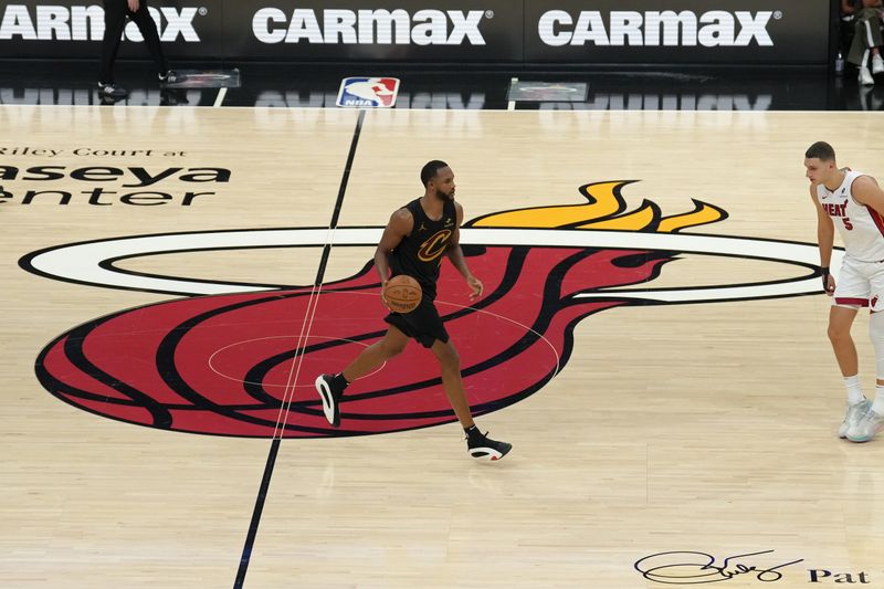 MIAMI, FL - APRIL 26: Evan Mobley #4 of the Cleveland Cavaliers brings the ball up court during the game against the Miami Heat during Round 1 Game 3 of the 2025 NBA Playoffs on April 26, 2025 at Kaseya Center in Miami, Florida. NOTE TO USER: User expressly acknowledges and agrees that, by downloading and or using this Photograph, user is consenting to the terms and conditions of the Getty Images License Agreement. Mandatory Copyright Notice: Copyright 2025 NBAE(Photo by Eric Espada/NBAE via Getty Images)