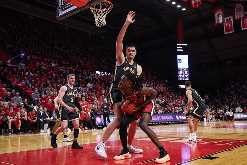 Jan 28, 2024; Piscataway, New Jersey, USA; Rutgers Scarlet Knights center Clifford Omoruyi (11) looks to the basket as Purdue Boilermakers center Zach Edey (15) defends during the second half at Jersey Mike's Arena. Mandatory Credit: Vincent Carchietta-USA TODAY Sports