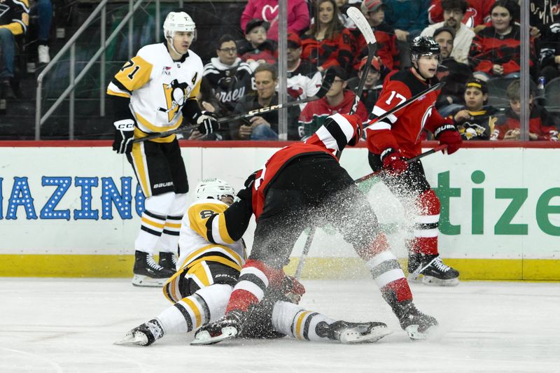 Apr 2, 2024; Newark, New Jersey, USA; Pittsburgh Penguins left wing Michael Bunting (8) is checked by New Jersey Devils right wing Alexander Holtz (10) during the first period at Prudential Center. Mandatory Credit: John Jones-USA TODAY Sports