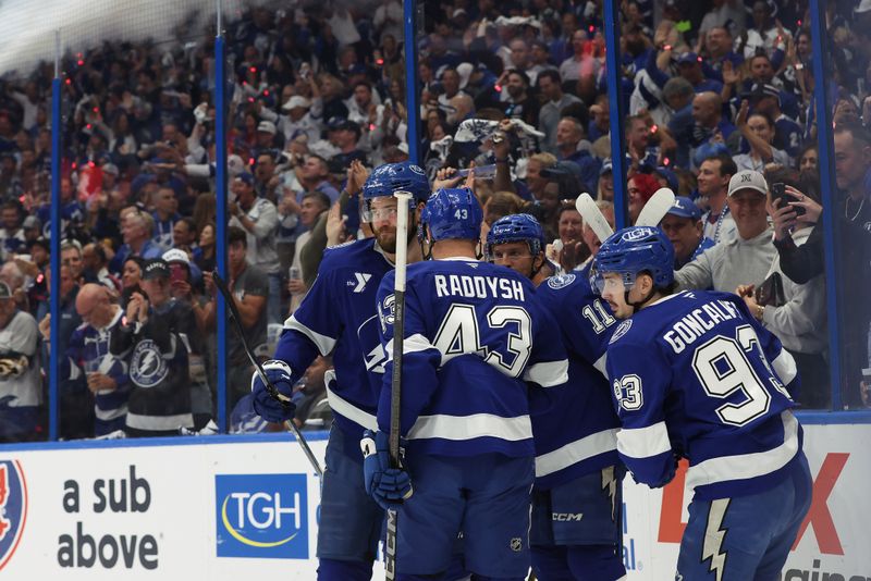 Apr 30, 2025; Tampa, Florida, USA; Tampa Bay Lightning center Gage Goncalves (93) celebrates with teammates after he scores a goal on Florida Panthers goaltender Sergei Bobrovsky (72) during the first period of game five of the first round of the 2025 Stanley Cup Playoffs at Amalie Arena. Mandatory Credit: Kim Klement Neitzel-Imagn Images