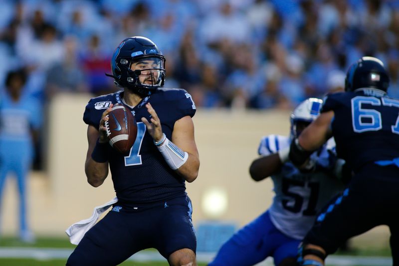 Oct 26, 2019; Chapel Hill, NC, USA; North Carolina Tar Heels quarterback Sam Howell (7) looks to pass against the Duke Blue Devils in the second half at Kenan Memorial Stadium. The North Carolina Tar Heels won 20-17. Mandatory Credit: Nell Redmond-USA TODAY Sports