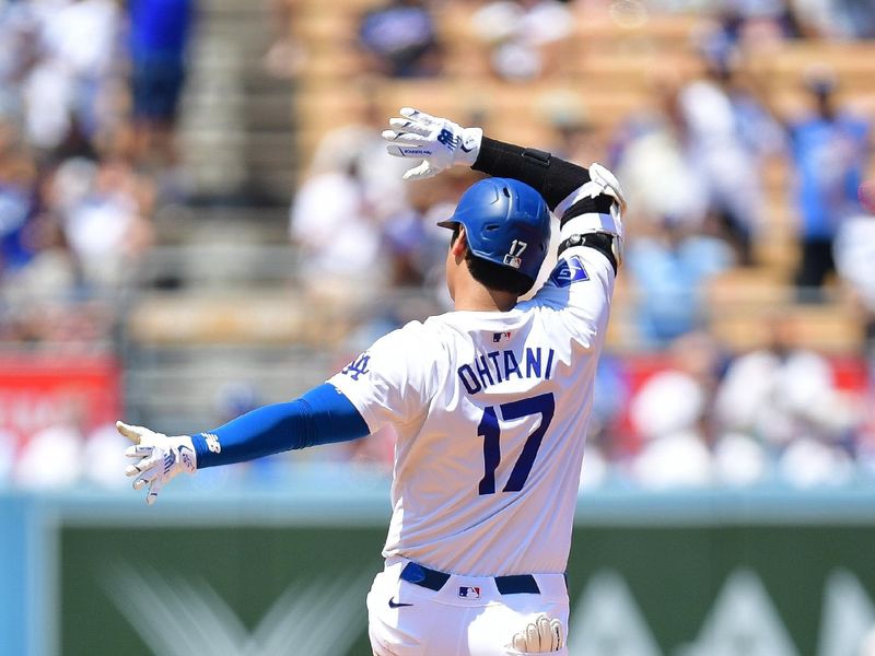 Jul 25, 2024; Los Angeles, California, USA; Los Angeles Dodgers designated hitter Shohei Ohtani (17) reacts after reaching second on a double against the San Francisco Giants during the fourth inning at Dodger Stadium. Mandatory Credit: Gary A. Vasquez-USA TODAY Sports