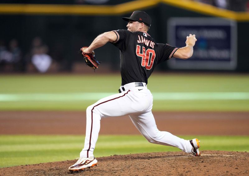 Sep 3, 2023; Phoenix, Arizona, USA; Arizona Diamondbacks relief pitcher Bryce Jarvis (40) pitches against the Baltimore Orioles during the seventh inning at Chase Field. Mandatory Credit: Joe Camporeale-USA TODAY Sports