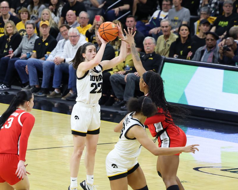 Mar 3, 2024; Iowa City, Iowa, USA; Iowa Hawkeyes guard Caitlin Clark (22) shoots against the Ohio State Buckeyes during the first half at Carver-Hawkeye Arena. Mandatory Credit: Reese Strickland-USA TODAY Sports