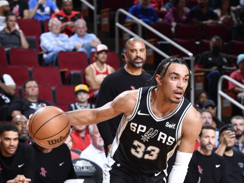 HOUSTON, TX - MARCH 5:  Tre Jones #33 of the San Antonio Spurs dribbles the ball during the game against the Houston Rockets on March 5, 2024 at the Toyota Center in Houston, Texas. NOTE TO USER: User expressly acknowledges and agrees that, by downloading and or using this photograph, User is consenting to the terms and conditions of the Getty Images License Agreement. Mandatory Copyright Notice: Copyright 2024 NBAE (Photo by Logan Riely/NBAE via Getty Images)