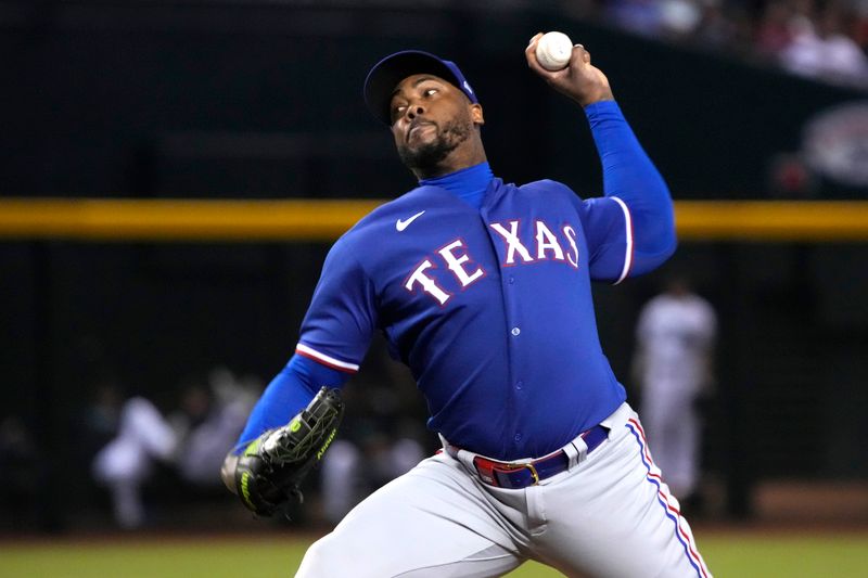 Aug 21, 2023; Phoenix, Arizona, USA; Texas Rangers relief pitcher Aroldis Chapman (45) throws against the Arizona Diamondbacks during the ninth inning at Chase Field. Mandatory Credit: Rick Scuteri-USA TODAY Sports