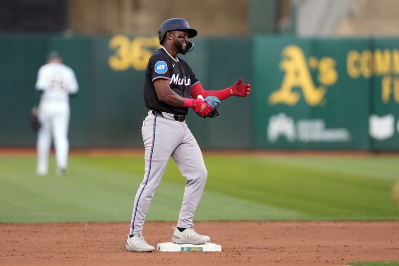 May 3, 2024; Oakland, California, USA; Miami Marlins third baseman Vidal Brujan (17) reacts after hitting a double against the Oakland Athletics during the third inning at Oakland-Alameda County Coliseum. Mandatory Credit: Darren Yamashita-USA TODAY Sports