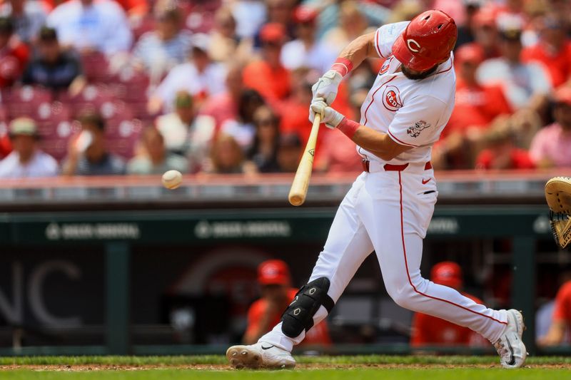 May 23, 2024; Cincinnati, Ohio, USA; Cincinnati Reds outfielder Nick Martini (23) hits a single against the San Diego Padres in the second inning at Great American Ball Park. Mandatory Credit: Katie Stratman-USA TODAY Sports