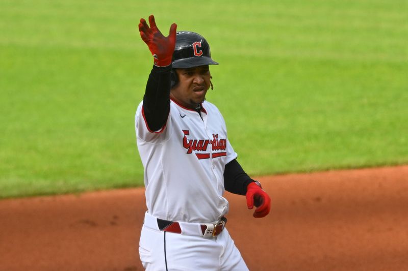 Apr 30, 2025; Cleveland, Ohio, USA; Cleveland Guardians third baseman Jose Ramirez (11) reacts after hitting a double in the first inning against the Minnesota Twins at Progressive Field. Mandatory Credit: David Richard-Imagn Images