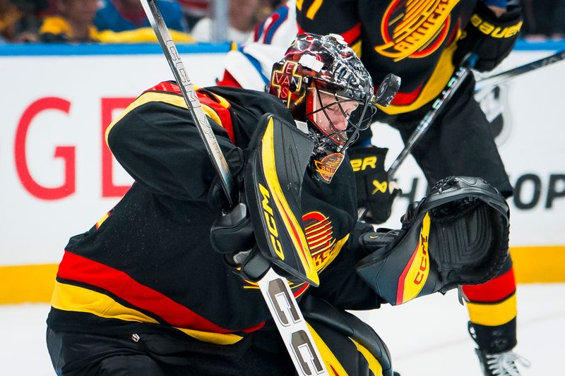 Oct 28, 2025; Vancouver, British Columbia, CAN; Vancouver Canucks goalie Thatcher Demko (35) makes a save against the New York Rangers in the third period at Rogers Arena. Mandatory Credit: Bob Frid-Imagn Images