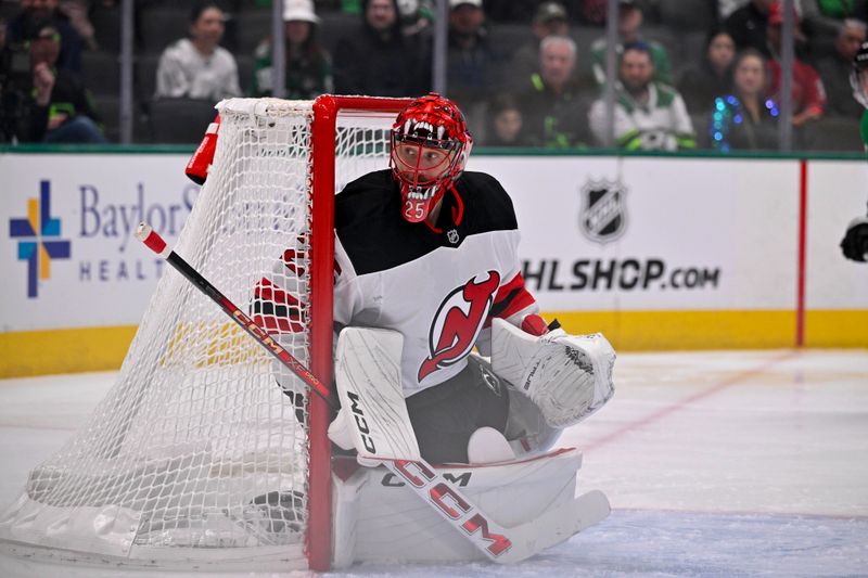 Mar 4, 2025; Dallas, Texas, USA; New Jersey Devils goaltender Jacob Markstrom (25) faces the Dallas Stars attack during the second period at the American Airlines Center. Mandatory Credit: Jerome Miron-Imagn Images