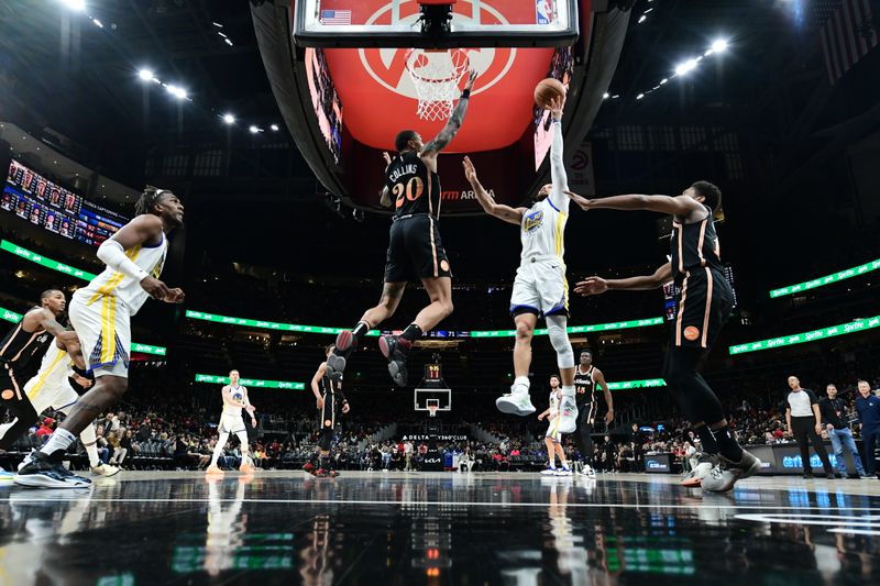 ATLANTA, GA - MARCH 17: Stephen Curry #30 of the Golden State Warriors drives to the basket during the game against the Atlanta Hawks on March 17, 2023 at State Farm Arena in Atlanta, Georgia.  NOTE TO USER: User expressly acknowledges and agrees that, by downloading and/or using this Photograph, user is consenting to the terms and conditions of the Getty Images License Agreement. Mandatory Copyright Notice: Copyright 2023 NBAE (Photo by Adam Hagy/NBAE via Getty Images)