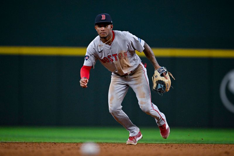 Aug 3, 2024; Arlington, Texas, USA;  Boston Red Sox shortstop Ceddanne Rafaela (43) tracks the ball during the eighth inning against the Texas Rangers at Globe Life Field. Mandatory Credit: Jerome Miron-USA TODAY Sports