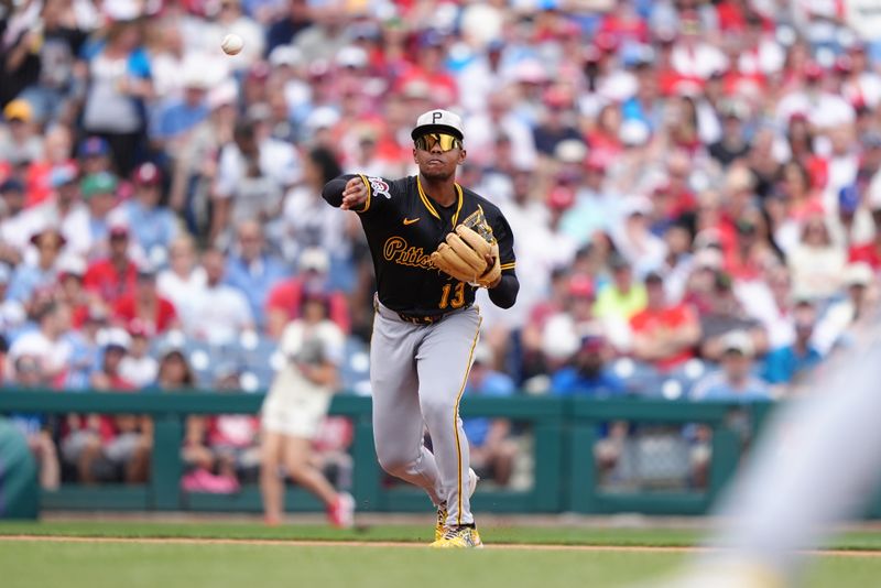 May 18, 2025; Philadelphia, Pennsylvania, USA; Pittsburgh Pirates infielder Ke'Bryan Hayes (13) throws to first against the Philadelphia Phillies in the first inning at Citizens Bank Park. Mandatory Credit: Kyle Ross-Imagn Images