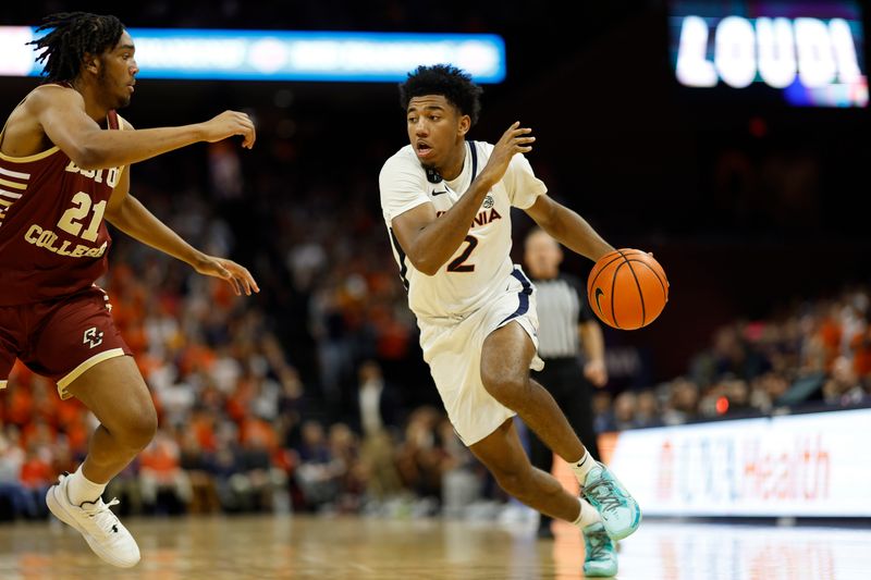 Jan 28, 2023; Charlottesville, Virginia, USA; Virginia Cavaliers guard Reece Beekman (2) drives to the basket as Boston College Eagles forward Devin McGlockton (21) defends in the second half at John Paul Jones Arena. Mandatory Credit: Geoff Burke-USA TODAY Sports