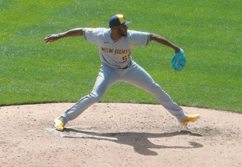 Sep 6, 2023; Pittsburgh, Pennsylvania, USA;  Milwaukee Brewers relief pitcher Elvis Peguero (59) pitches against the Pittsburgh Pirates during the seventh inning at PNC Park. Pittsburgh won 5-4. Mandatory Credit: Charles LeClaire-USA TODAY Sports