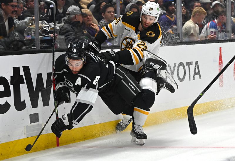 Jan 5, 2023; Los Angeles, California, USA;  Los Angeles Kings defenseman Drew Doughty (8) is checked into the boards by Boston Bruins defenseman Derek Forbort (28) in the third period at Crypto.com Arena. Mandatory Credit: Jayne Kamin-Oncea-USA TODAY Sports