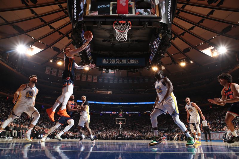 NEW YORK, NY - FEBRUARY 29: Donte Divincenzo #0 of the New York Knicks drives to the basket during the game against the Golden State Warriors on January 29, 2024 at Madison Square Garden in New York City, New York.  NOTE TO USER: User expressly acknowledges and agrees that, by downloading and or using this photograph, User is consenting to the terms and conditions of the Getty Images License Agreement. Mandatory Copyright Notice: Copyright 2024 NBAE  (Photo by Nathaniel S. Butler/NBAE via Getty Images)