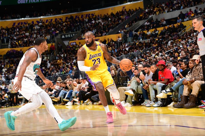 LOS ANGELES, CA - NOVEMBER 13: LeBron James #23 of the Los Angeles Lakers handles the ball during the game against the Memphis Grizzlies on November 13, 2024 at Crypto.Com Arena in Los Angeles, California. NOTE TO USER: User expressly acknowledges and agrees that, by downloading and/or using this Photograph, user is consenting to the terms and conditions of the Getty Images License Agreement. Mandatory Copyright Notice: Copyright 2024 NBAE (Photo by Adam Pantozzi/NBAE via Getty Images)