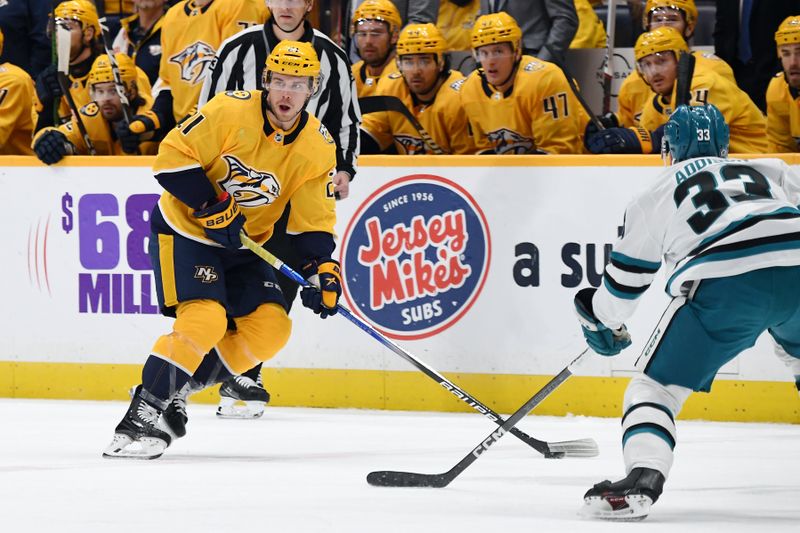 Mar 19, 2024; Nashville, Tennessee, USA; Nashville Predators left wing Anthony Beauvillier (21) skates with the puck during the first period against the San Jose Sharks at Bridgestone Arena. Mandatory Credit: Christopher Hanewinckel-USA TODAY Sports