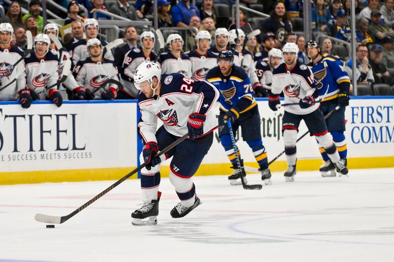 Oct 1, 2024; St. Louis, Missouri, USA;  Columbus Blue Jackets right wing Mathieu Olivier (24) controls the puck against the St. Louis Blues during the third period at Enterprise Center. Mandatory Credit: Jeff Curry-Imagn Images