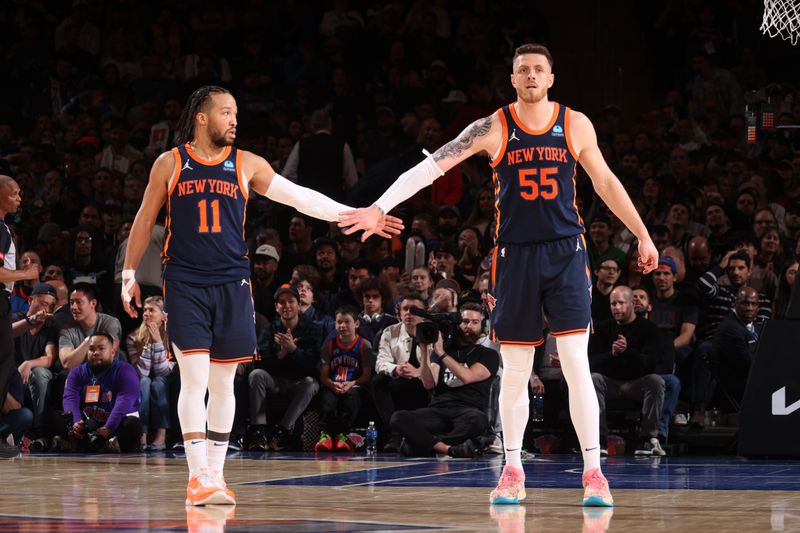 NEW YORK, NY - APRIL 4: Jalen Brunson #11 and Isaiah Hartenstein #55 of the New York Knicks high five against the Sacramento Kings on April 4, 2024 at Madison Square Garden in New York City, New York.  NOTE TO USER: User expressly acknowledges and agrees that, by downloading and or using this photograph, User is consenting to the terms and conditions of the Getty Images License Agreement. Mandatory Copyright Notice: Copyright 2024 NBAE  (Photo by Nathaniel S. Butler/NBAE via Getty Images)