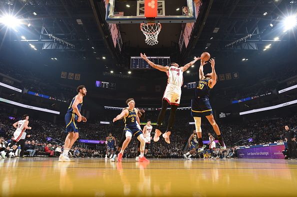 SAN FRANCISCO, CA - DECEMBER 28: RJ Hampton #4 of the Miami Heat and Stephen Curry #30 of the Golden State Warriors go up for the rebound during the game on December 28, 2023 at Chase Center in San Francisco, California. NOTE TO USER: User expressly acknowledges and agrees that, by downloading and or using this photograph, user is consenting to the terms and conditions of Getty Images License Agreement. Mandatory Copyright Notice: Copyright 2023 NBAE (Photo by Noah Graham/NBAE via Getty Images)