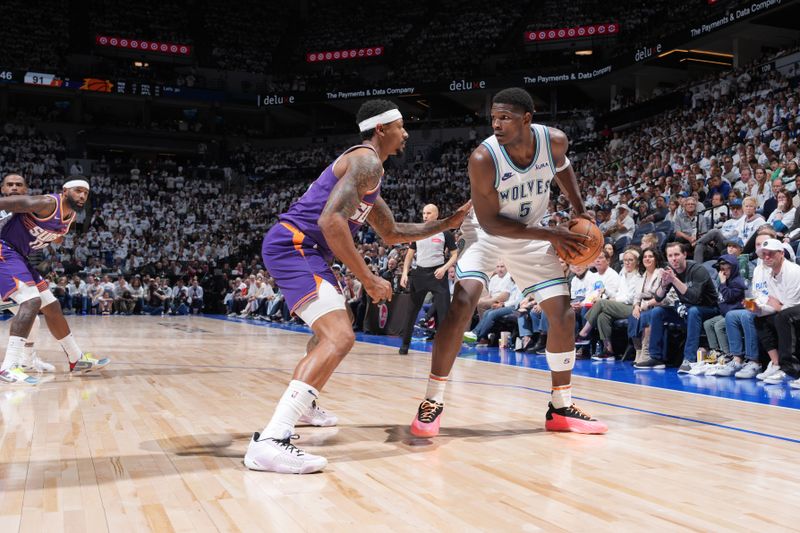 MINNEAPOLIS, MN -  APRIL 20: Anthony Edwards #5 of the Minnesota Timberwolves handles the ball during Round One Game One of the 2024 NBA Playoffs against the Phoenix Suns on April 20, 2024 at Target Center in Minneapolis, Minnesota. NOTE TO USER: User expressly acknowledges and agrees that, by downloading and or using this Photograph, user is consenting to the terms and conditions of the Getty Images License Agreement. Mandatory Copyright Notice: Copyright 2024 NBAE (Photo by Jordan Johnson/NBAE via Getty Images)