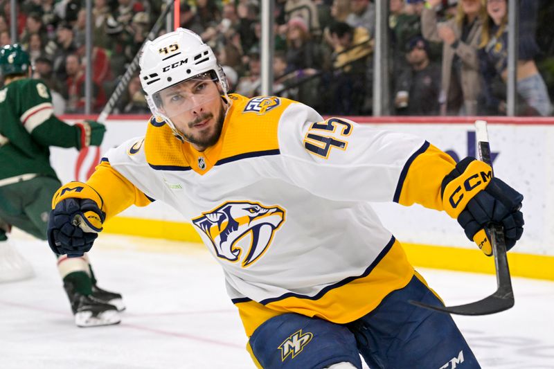 Jan 25, 2024; Saint Paul, Minnesota, USA; Nashville Predators defenseman Alexandre Carrier (45) celebrates his goal against the Minnesota Wild during the third period at Xcel Energy Center. Mandatory Credit: Nick Wosika-USA TODAY Sports