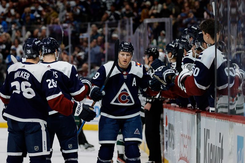 Apr 9, 2024; Denver, Colorado, USA; Colorado Avalanche center Nathan MacKinnon (29) celebrates with teammates after his goal in the first period against the Minnesota Wild at Ball Arena. Mandatory Credit: Isaiah J. Downing-USA TODAY Sports