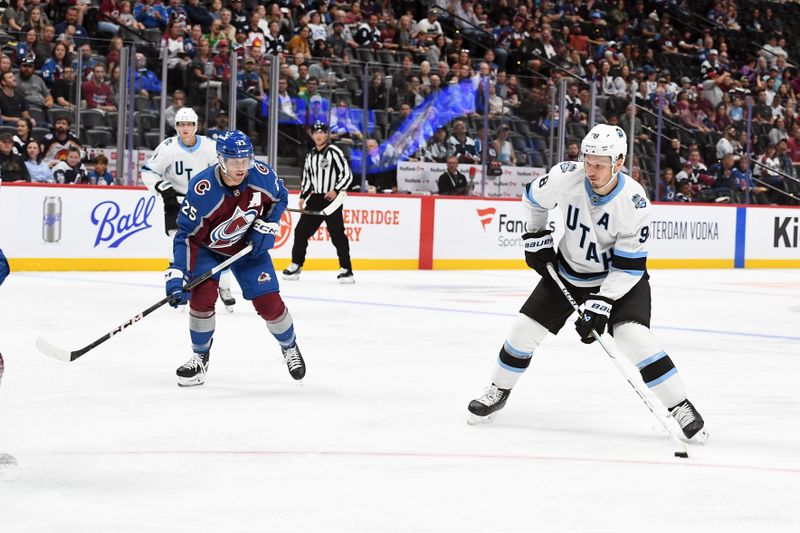 Sep 29, 2024; Denver, Colorado, USA; Utah Hockey Club defenseman Mikhail Sergachyov (98) shoots the puck during the first period against the Colorado Avalanche at Ball Arena. Mandatory Credit: Christopher Hanewinckel-Imagn Images