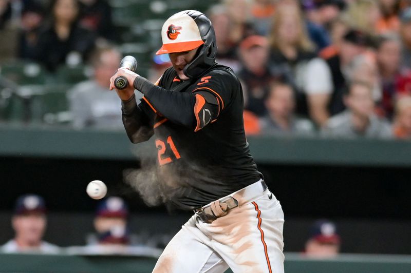 Sep 27, 2023; Baltimore, Maryland, USA;  Baltimore Orioles left fielder Austin Hays (21) reacts after being hit by a pitch during the game against the Washington Nationals at Oriole Park at Camden Yards. Mandatory Credit: Tommy Gilligan-USA TODAY Sports