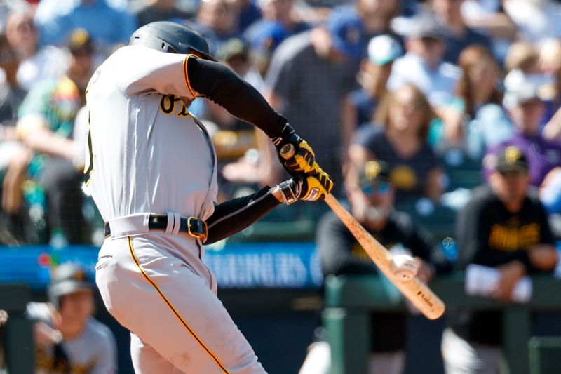 May 28, 2023; Seattle, Washington, USA; Pittsburgh Pirates designated hitter Bryan Reynolds (10) hits an RBI-triple against the Seattle Mariners during the eighth inning at T-Mobile Park. Mandatory Credit: Joe Nicholson-USA TODAY Sports