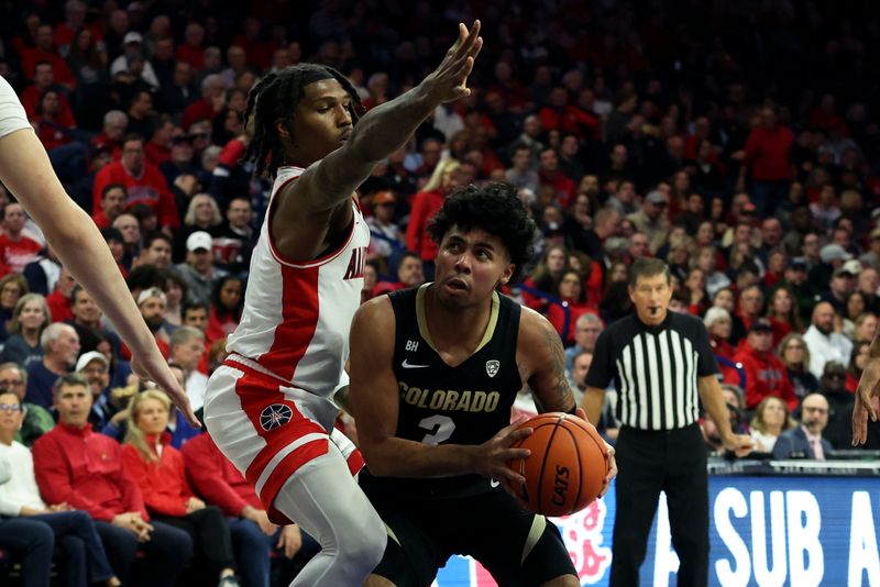 Jan 4, 2024; Tucson, Arizona, USA; Colorado Buffaloes guard Julian Hammond III (3) shoots a basket against Arizona Wildcats guard Caleb Love (2) during the first half at McKale Center. Mandatory Credit: Zachary BonDurant-USA TODAY Sports