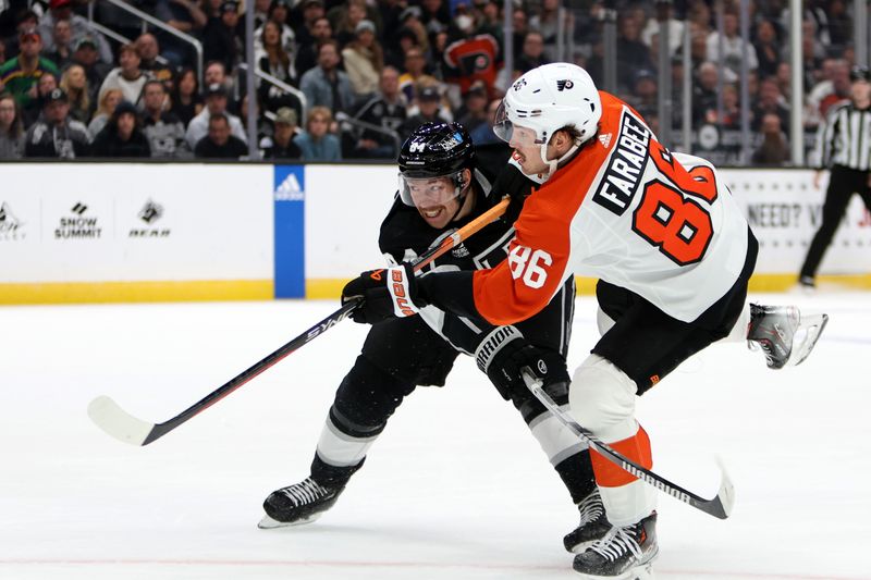 Nov 11, 2023; Los Angeles, California, USA;  Philadelphia Flyers left wing Joel Farabee (86) shoots the puck as defended by Los Angeles Kings defenseman Vladislav Gavrikov (84) during the first period at Crypto.com Arena. Mandatory Credit: Kiyoshi Mio-USA TODAY Sports